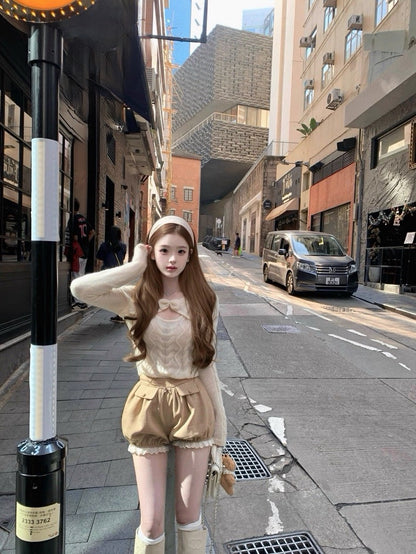 Tue. 妮妮千金 蝴蝶結挖空海馬麻花毛衣 伯爵茶短褲