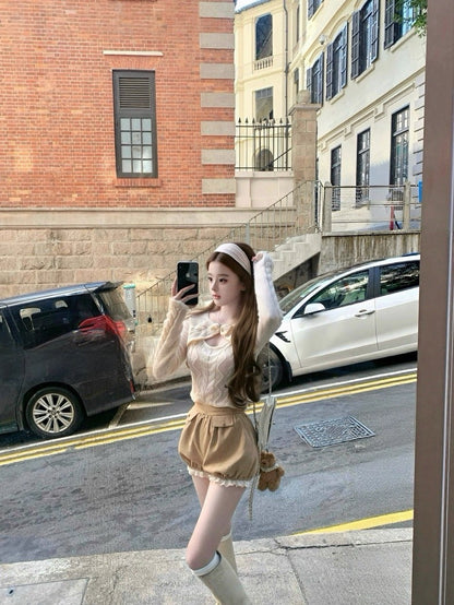 Tue. 妮妮千金 蝴蝶結挖空海馬麻花毛衣 伯爵茶短褲